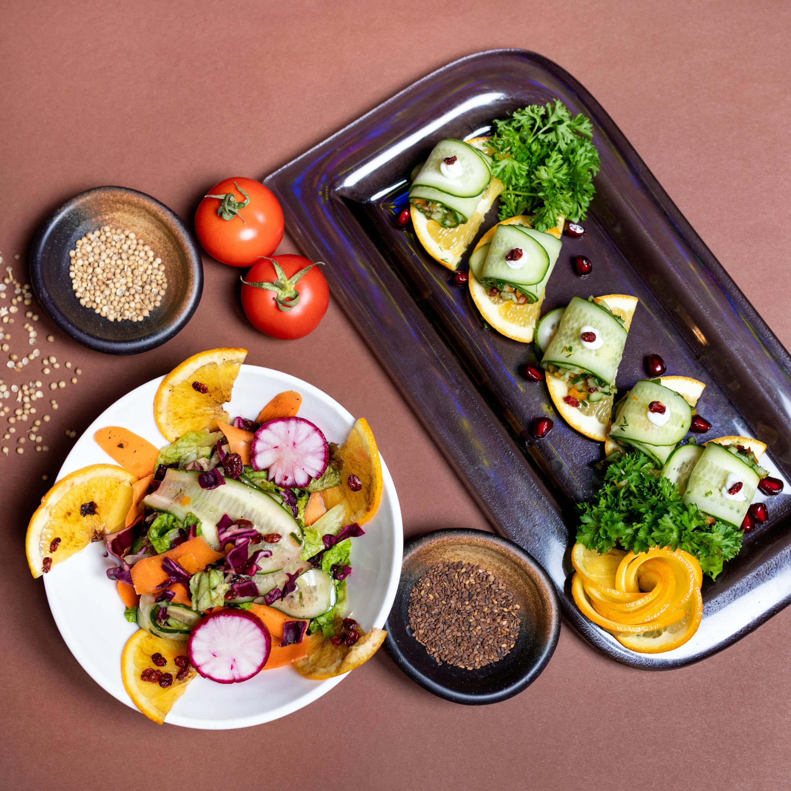 Our Team Top view of a colorful vegetarian salad and appetizer platter with fresh vegetables and garnishes.